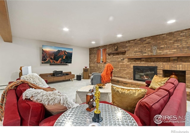 4456 W Pioneer Dr, Greeley, CO 80634 - carpeted living area featuring a brick fireplace, recessed lighting, and brick wall