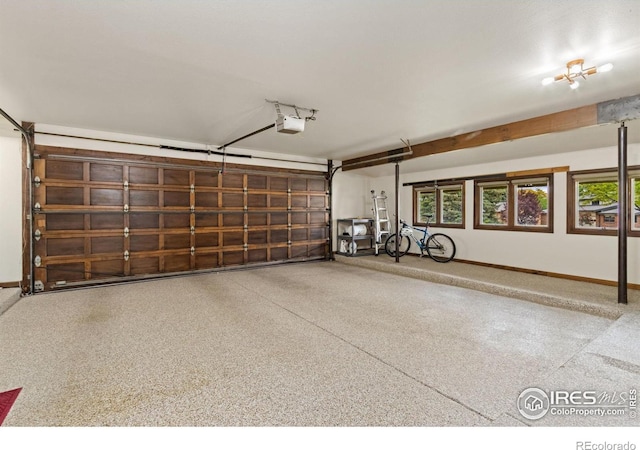 4456 W Pioneer Dr, Greeley, CO 80634 - garage featuring a garage door opener and baseboards