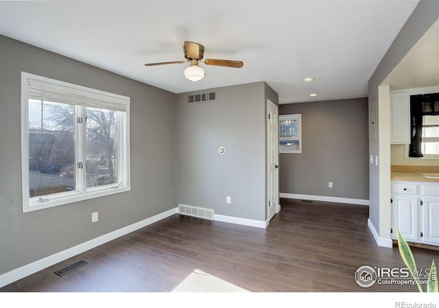 400 Emery St Unit 208, Longmont, CO 80501 - spare room featuring baseboards, wood finished floors, recessed lighting, and ceiling fan