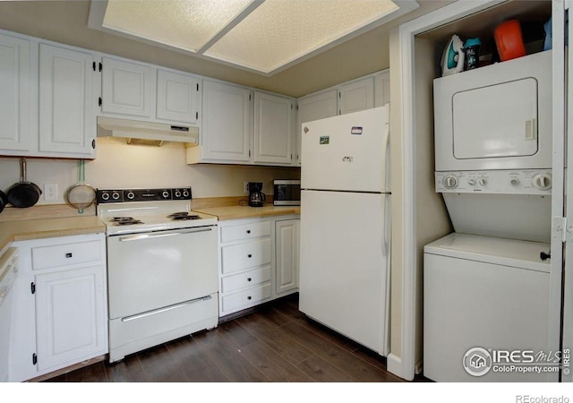 400 Emery St Unit 208, Longmont, CO 80501 - kitchen with white appliances, estacked washer and dryer, under cabinet range hood, dark wood-type flooring, and white cabinetry