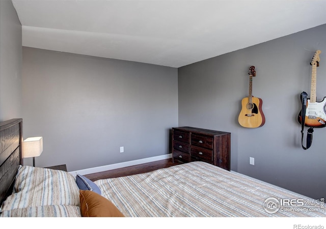 400 Emery St Unit 208, Longmont, CO 80501 - bedroom with wood finished floors and baseboards