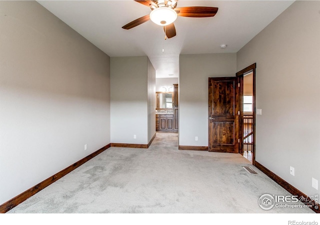 3570 Saguaro Dr, Loveland, CO 80537 - unfurnished bedroom featuring baseboards, carpet flooring, connected bathroom, and a ceiling fan