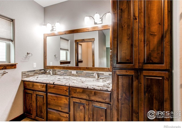 3570 Saguaro Dr, Loveland, CO 80537 - full bathroom with double vanity and decorative backsplash