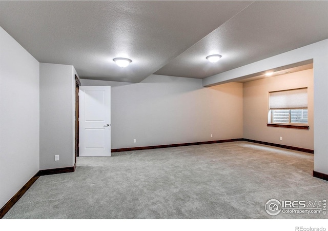 3570 Saguaro Dr, Loveland, CO 80537 - basement with carpet floors, baseboards, and a textured ceiling