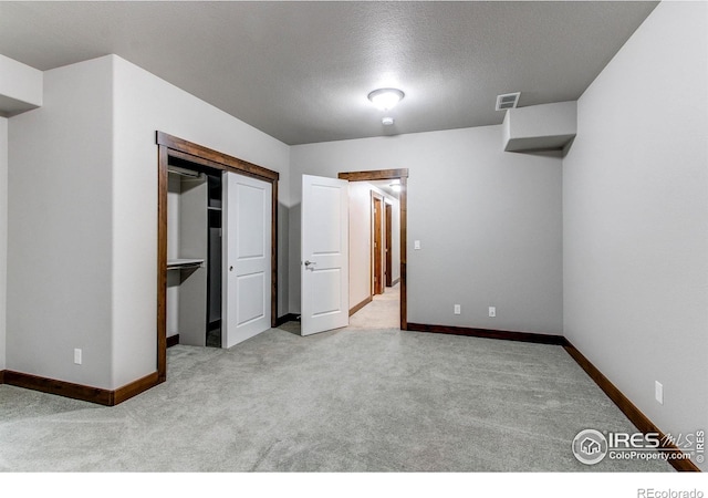 3570 Saguaro Dr, Loveland, CO 80537 - unfurnished bedroom with carpet floors, baseboards, a textured ceiling, and a closet