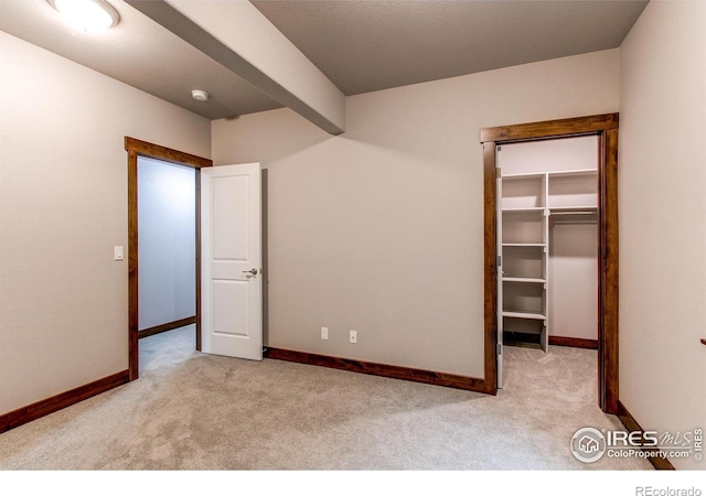3570 Saguaro Dr, Loveland, CO 80537 - unfurnished bedroom with carpet flooring, a walk in closet, baseboards, and a closet