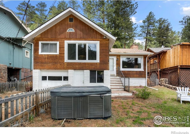 2459 W US Highway 34, Drake, CO 80515 - rear view of house with a hot tub and a chimney