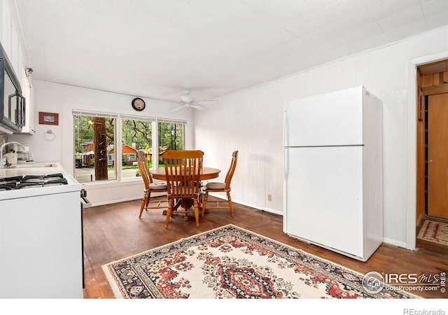 2459 W US Highway 34, Drake, CO 80515 - dining room with a ceiling fan, wood finished floors, and baseboards