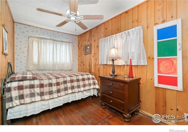 2459 W US Highway 34, Drake, CO 80515 - bedroom with hardwood / wood-style floors, ornamental molding, wood walls, and a ceiling fan