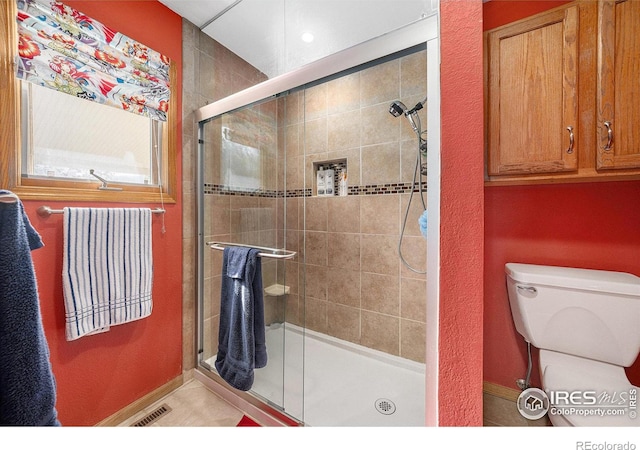 4601 N Sunshine Ct, Loveland, CO 80537 - bathroom with a stall shower, baseboards, and toilet