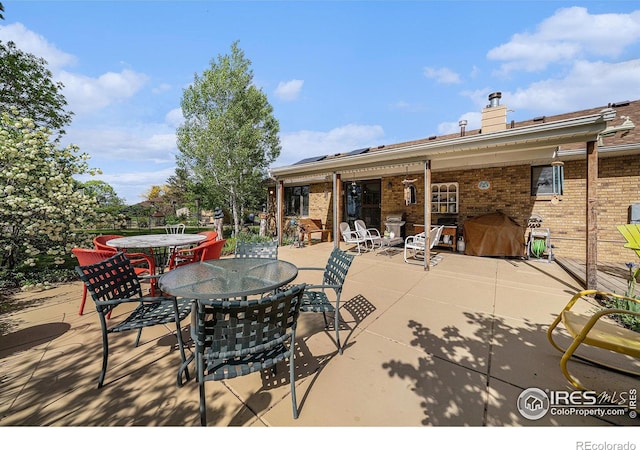 4601 N Sunshine Ct, Loveland, CO 80537 - view of patio featuring outdoor dining space