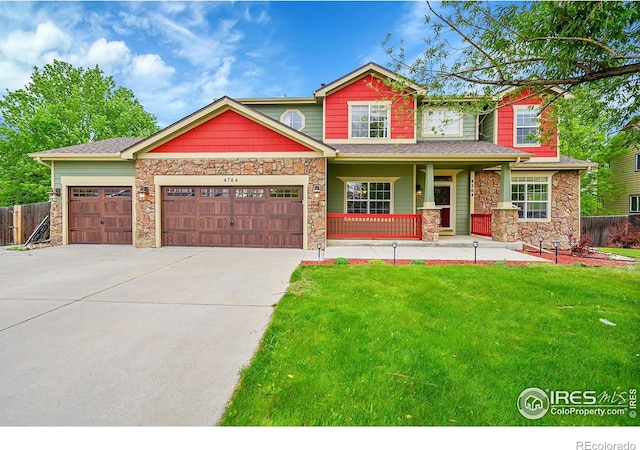 4764 Maggie Ct, Loveland, CO 80537 - craftsman-style home featuring stone siding, driveway, an attached garage, and covered porch
