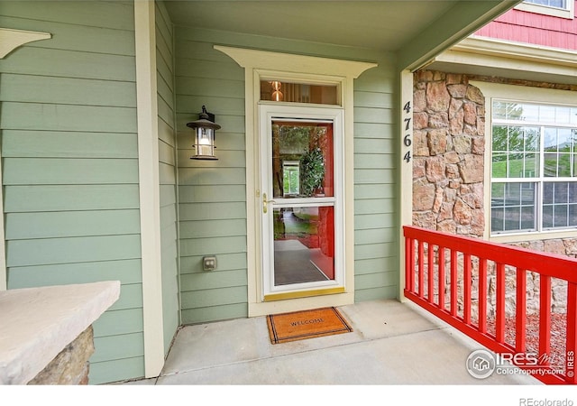4764 Maggie Ct, Loveland, CO 80537 - entrance to property with covered porch and stone siding