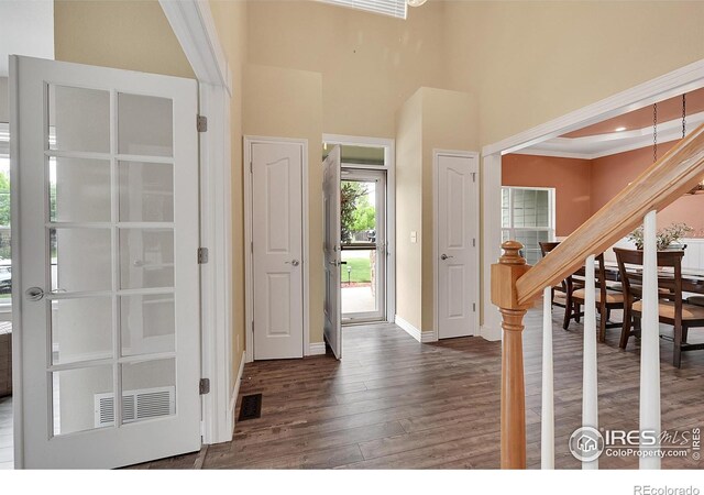 4764 Maggie Ct, Loveland, CO 80537 - entrance foyer with wood finished floors, baseboards, stairs, and a high ceiling