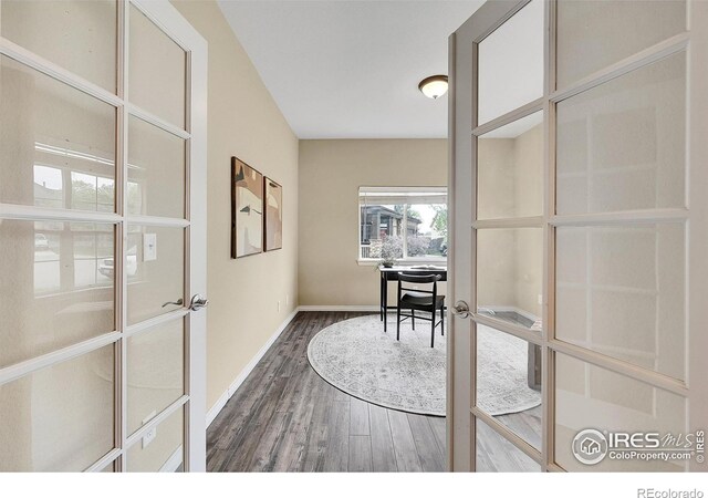 4764 Maggie Ct, Loveland, CO 80537 - home office featuring dark wood-style floors, baseboards, and french doors