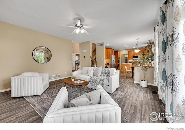 4764 Maggie Ct, Loveland, CO 80537 - living room featuring stairs, wood finished floors, baseboards, and recessed lighting