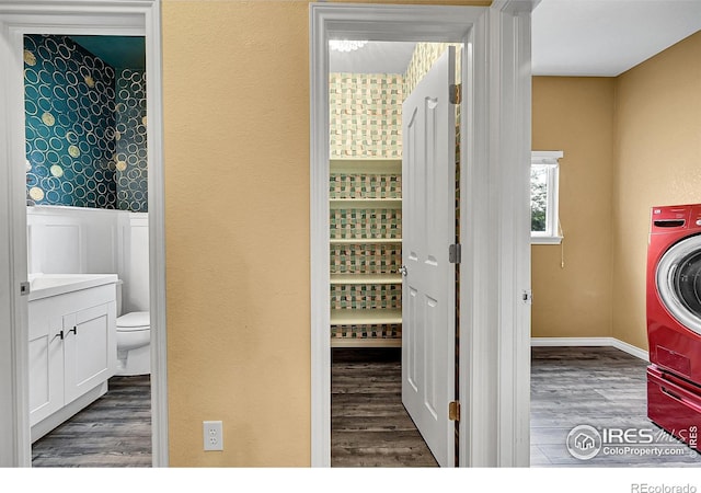 4764 Maggie Ct, Loveland, CO 80537 - laundry area featuring wood finished floors and a wainscoted wall