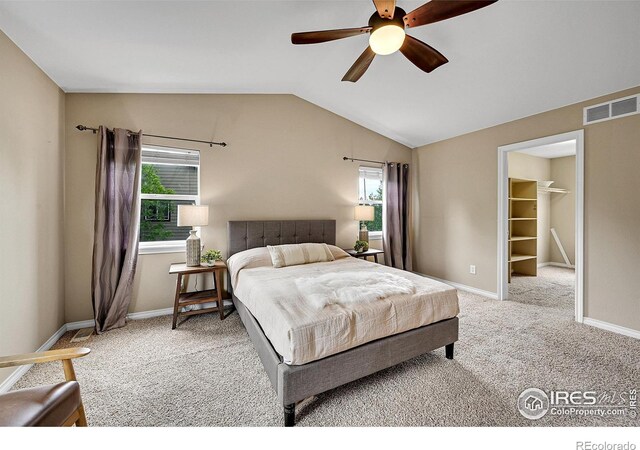 4764 Maggie Ct, Loveland, CO 80537 - bedroom featuring carpet floors, lofted ceiling, baseboards, a ceiling fan, and a walk in closet