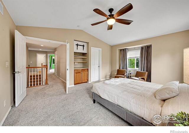 4764 Maggie Ct, Loveland, CO 80537 - bedroom with lofted ceiling, light colored carpet, baseboards, and ceiling fan