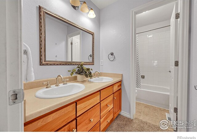 4764 Maggie Ct, Loveland, CO 80537 - bathroom with double vanity, toilet, tile patterned floors, and shower / tub combination