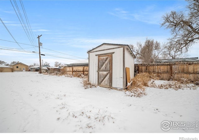 513 N 2nd Ave, Sterling, CO 80751 - snow covered structure featuring a storage shed