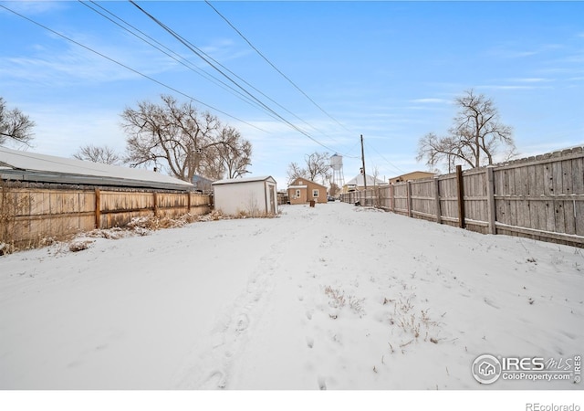 513 N 2nd Ave, Sterling, CO 80751 - snowy yard featuring a fenced backyard