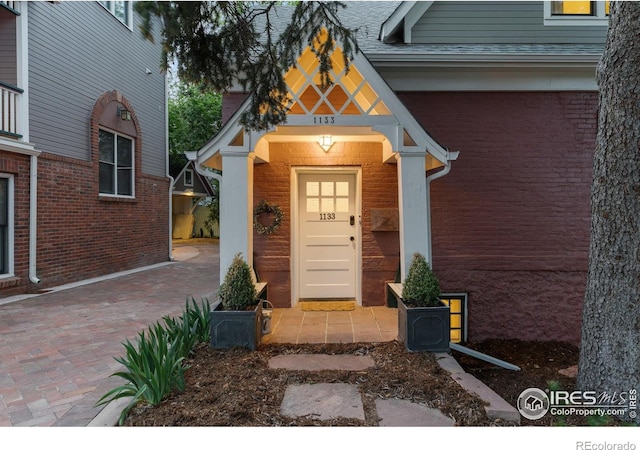 1133 Mapleton Ave, Boulder, CO 80304 - property entrance with brick siding and a shingled roof