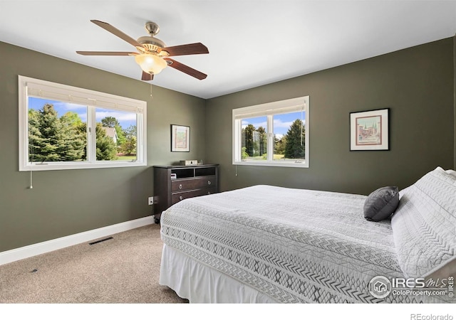 1119 Wrangler Way, Loveland, CO 80537 - carpeted bedroom with baseboards and ceiling fan