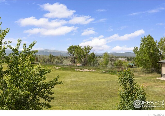 1119 Wrangler Way, Loveland, CO 80537 - view of yard featuring a mountain view
