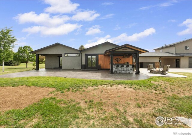 1119 Wrangler Way, Loveland, CO 80537 - view of front of property with a front yard and a patio