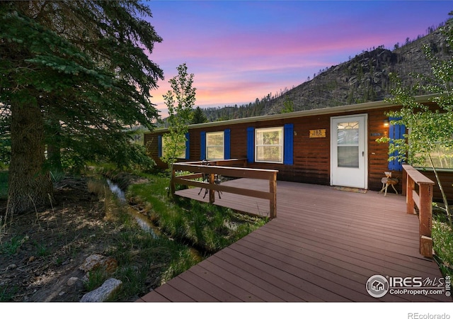 185 Meadow Ln, Bellvue, CO 80512 - deck at dusk with a mountain view
