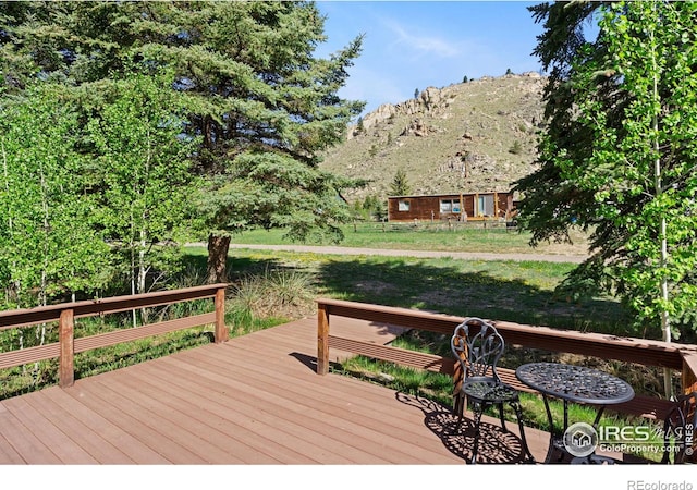 185 Meadow Ln, Bellvue, CO 80512 - wooden deck featuring a mountain view and a lawn