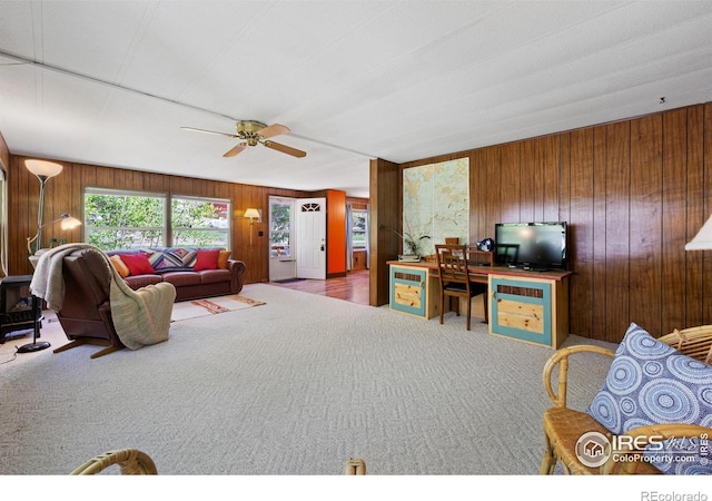 185 Meadow Ln, Bellvue, CO 80512 - living area featuring carpet, a ceiling fan, and wood walls