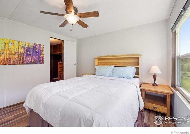 185 Meadow Ln, Bellvue, CO 80512 - bedroom with wood finished floors, multiple windows, and a ceiling fan