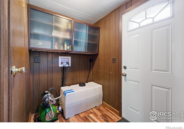 185 Meadow Ln, Bellvue, CO 80512 - laundry room with hookup for a washing machine, wood walls, and wood finished floors
