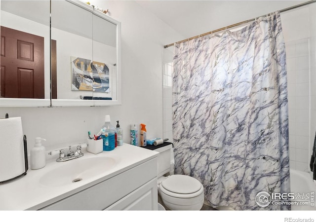 bathroom with shower / tub combo, toilet, and vanity