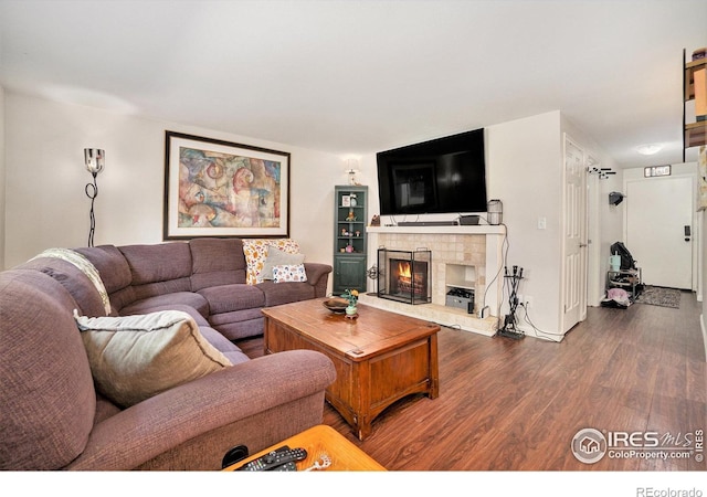 925 Columbia Rd Unit 714, Fort Collins, CO 80525 - living room with wood finished floors and a lit fireplace