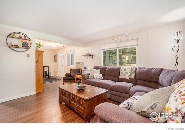 925 Columbia Rd Unit 714, Fort Collins, CO 80525 - living area with wood finished floors, baseboards, and an AC wall unit