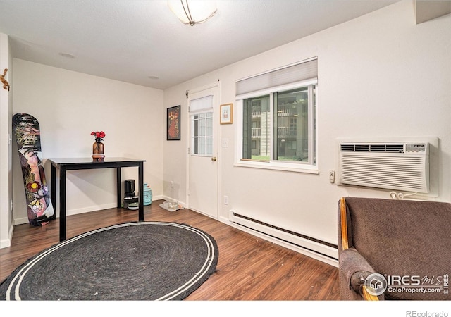 925 Columbia Rd Unit 714, Fort Collins, CO 80525 - entryway featuring a baseboard radiator, wood finished floors, a wall mounted air conditioner, and baseboards