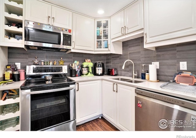 925 Columbia Rd Unit 714, Fort Collins, CO 80525 - kitchen with stainless steel appliances, a sink, light countertops, and white cabinetry