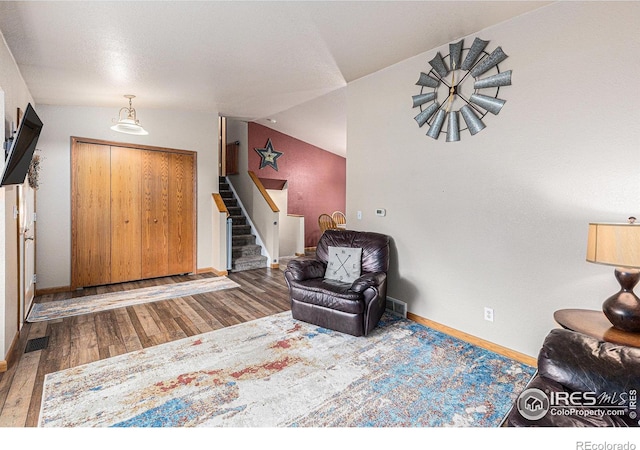 2325 42nd Avenue Ct, Greeley, CO 80634 - entrance foyer with stairs, wood finished floors, baseboards, and lofted ceiling