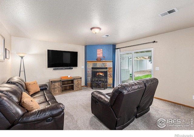 2325 42nd Avenue Ct, Greeley, CO 80634 - living room featuring carpet, baseboards, a fireplace, and a textured ceiling