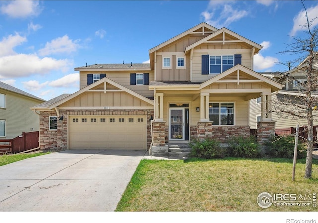 6071 Moran Rd, Timnath, CO 80547 - craftsman-style home with board and batten siding, an attached garage, driveway, and stone siding