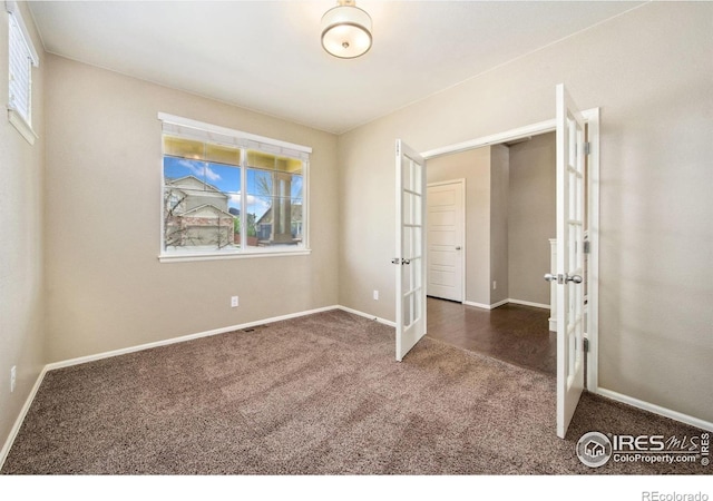 6071 Moran Rd, Timnath, CO 80547 - unfurnished bedroom with french doors, carpet, and baseboards
