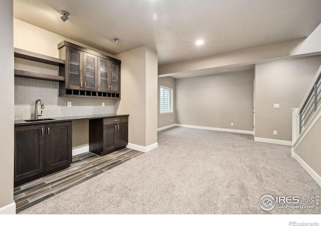6071 Moran Rd, Timnath, CO 80547 - bar with a sink, decorative backsplash, baseboards, light colored carpet, and recessed lighting