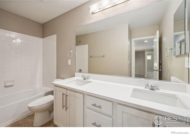 6071 Moran Rd, Timnath, CO 80547 - bathroom featuring toilet, tile patterned floors, double vanity, and tub / shower combination