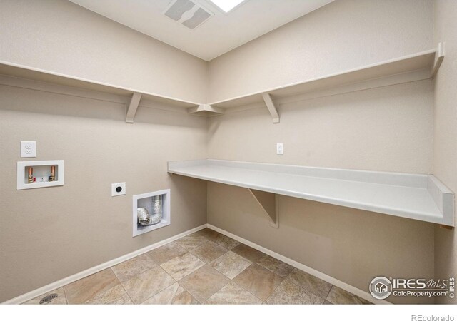 6071 Moran Rd, Timnath, CO 80547 - laundry area with washer hookup, hookup for an electric dryer, baseboards, and light stone finish floors