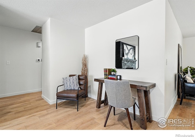 1832 24th Avenue Pl, Greeley, CO 80634 - office area featuring wood finished floors and baseboards