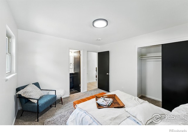 1832 24th Avenue Pl, Greeley, CO 80634 - bedroom with carpet, a closet, baseboards, and ensuite bathroom