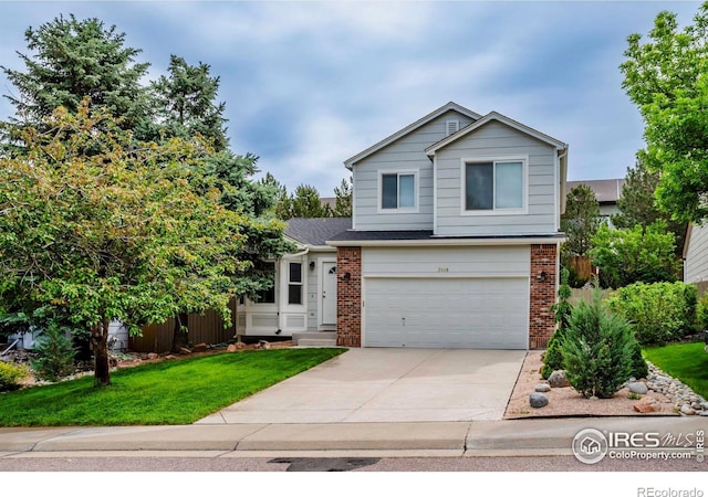 2940 E Yarrow Cir, Superior, CO 80027 - view of front of home with concrete driveway, a garage, brick siding, and a front yard